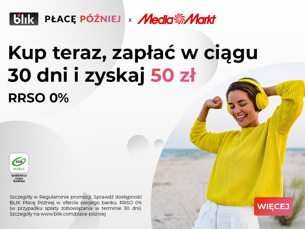 Szczęśliwa dziewczyna z żółtym swetrze i ze słuchawkami na uszach.